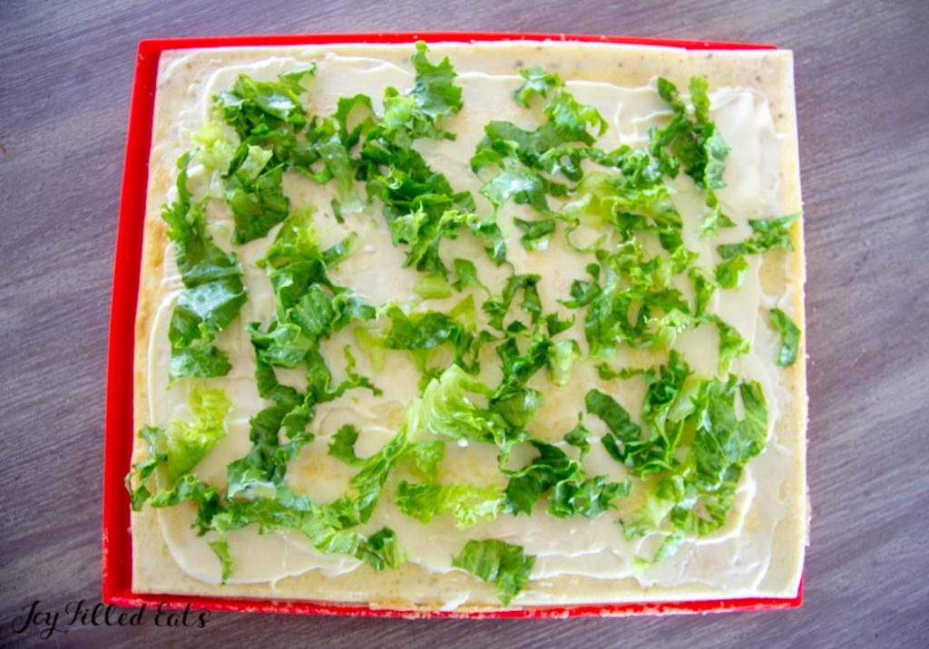 lettuce spread around on an egg roulade base