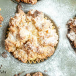 Overhead close up view of keto coffee cake muffin in metal muffin tin