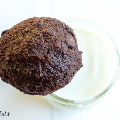overhead view of keto brownie cookie balancing on a glass of milk