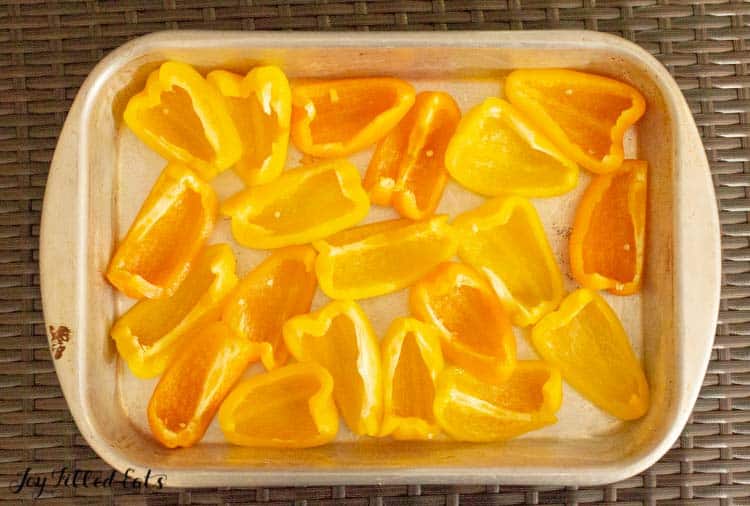casserole dish lined with yellow bell pepper segments