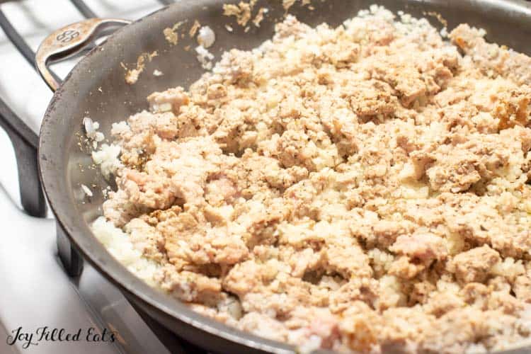 ground meat filling in skillet for stuffed pepper casserole