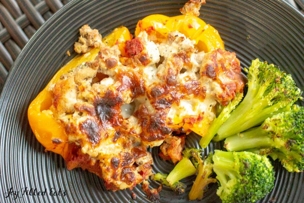 overhead view of stuffed pepper casserole serving on a plate with broccoli