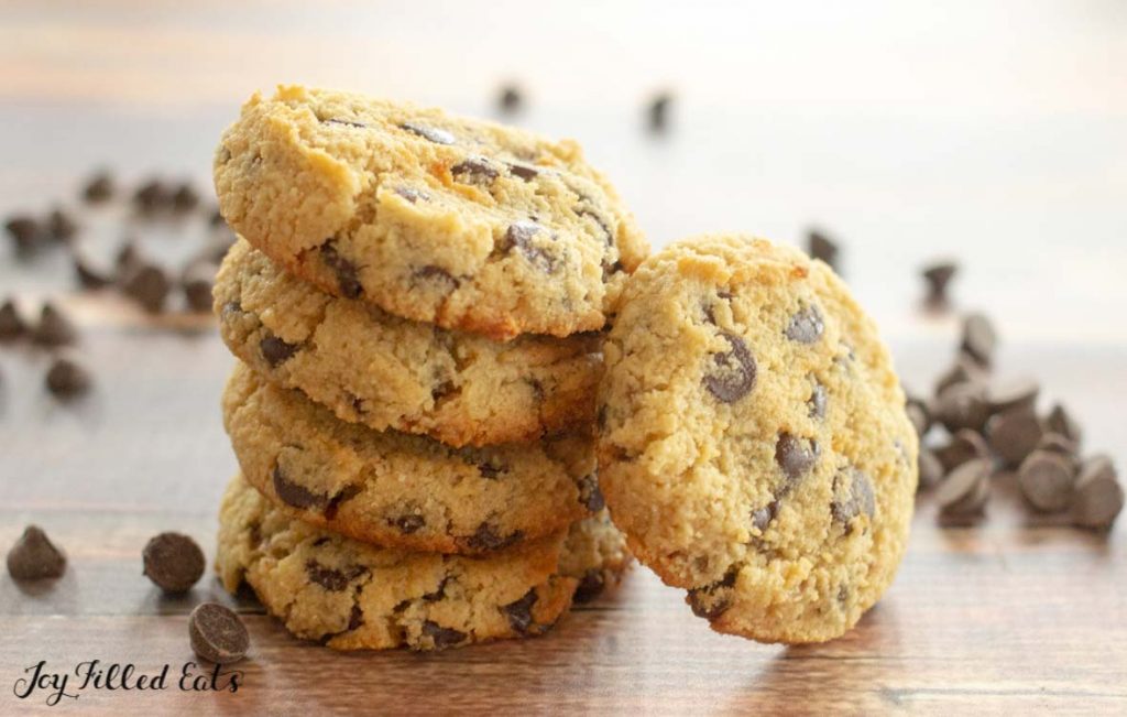 stack of eggless chocolate chip cookies with one cookie leaning on stack