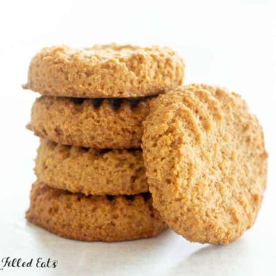 stack of dairy-free peanut butter cookies with one cookie leaning on stack