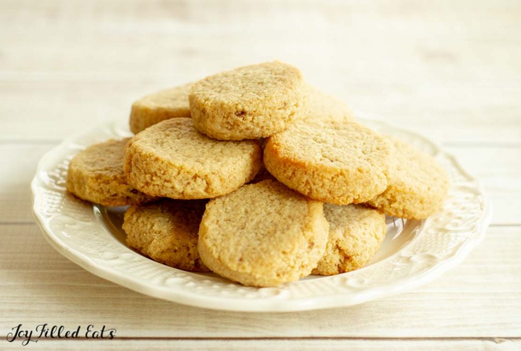 pile of ginger molasses cookies on white plate