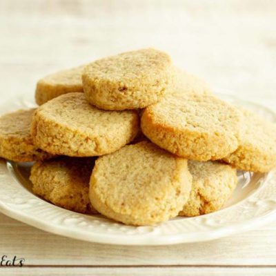 pile of ginger molasses cookies on white plate