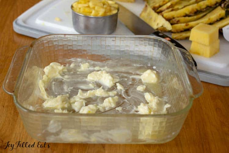 softened butter spread on bottom of baking dish