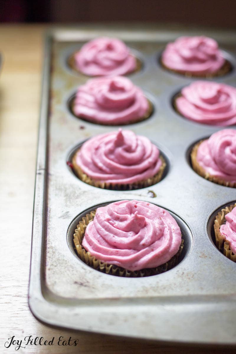 chocolate champagne cupcakes with raspberry frosting in pan