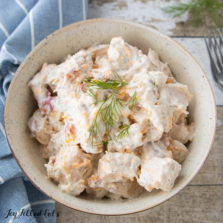 Close up of Keto Bacon Ranch Chicken Salad topped with Fresh Dill