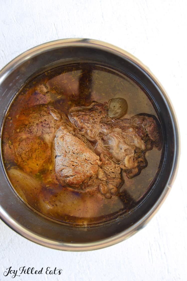 pot roast in liquid inside instant pot