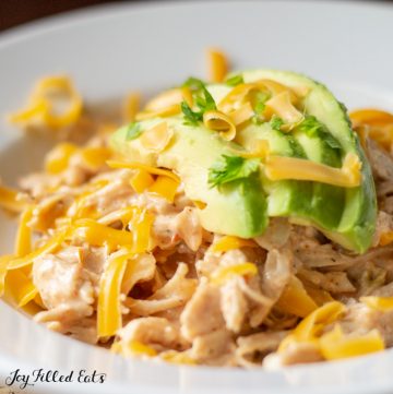 Instant Pot Mexican Chicken in a bowl topped with avocado