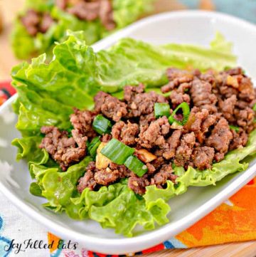 asian lettuce wrap with ground beef placed on a white plate close up