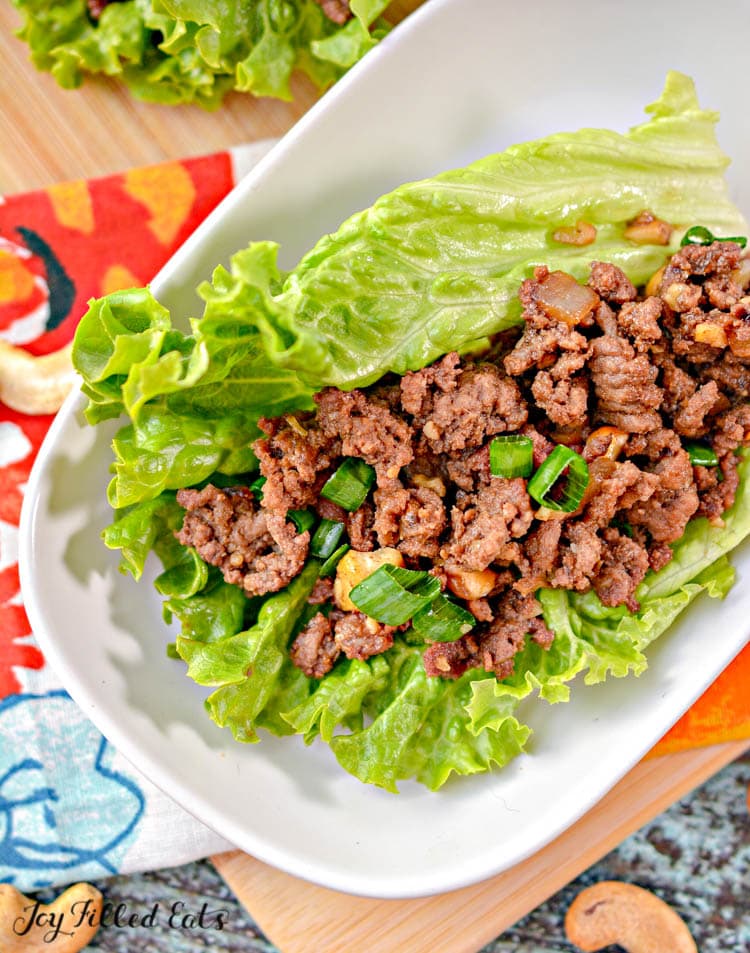 asian lettuce wrap with ground beef placed on a white plate