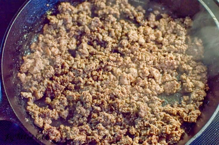 ground meat cooking in skillet close up