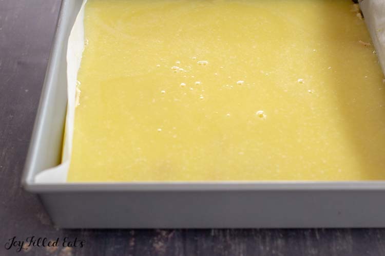 keto lemon bars in baking dish before being cut into squares