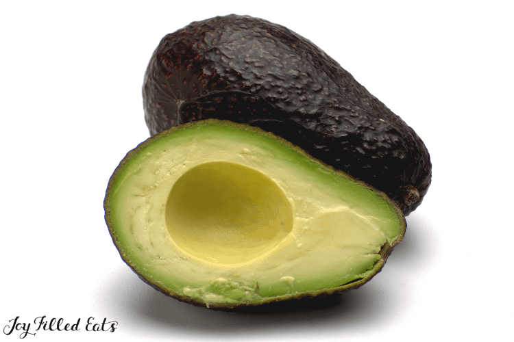 cut in half avocado with pit removed