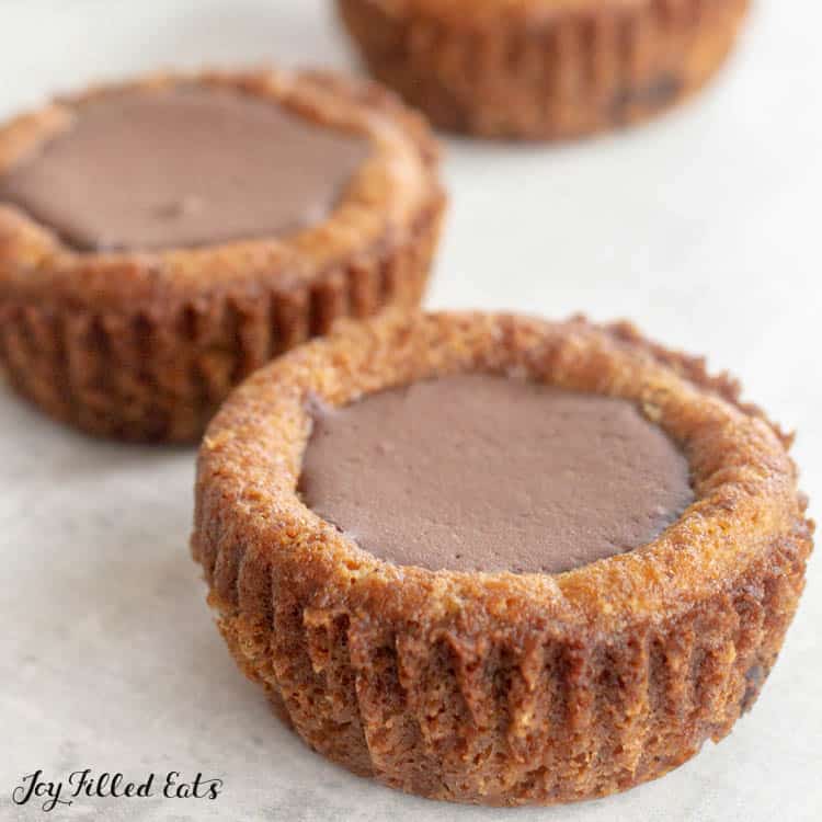 close up on chocolate chip cookie cups on surface