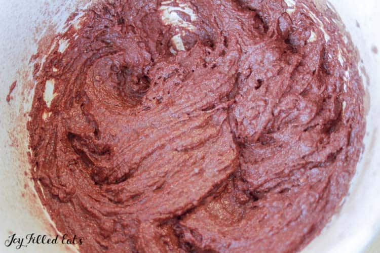 Large mixing bowl of chocolate cake batter