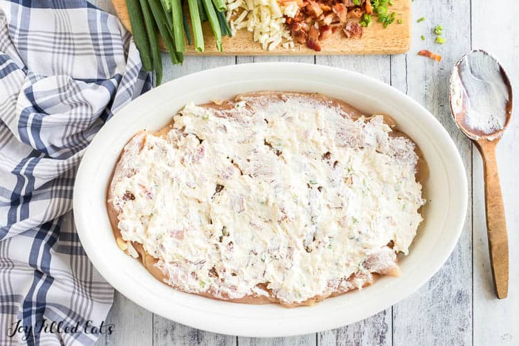 cream cheese mixture spread over tenders in shallow casserole dish