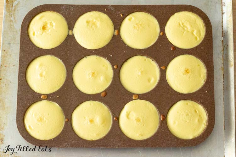 muffin tin full of individual cheesecakes