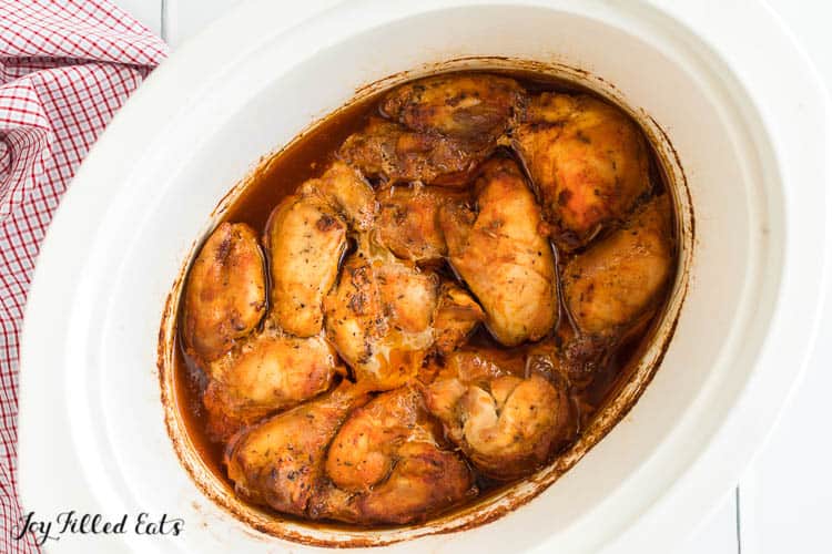 chicken portions covering in sauce within crockpot