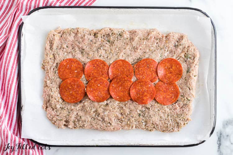 meatloaf rolled into bottom of baking dish and topped with a center layer of pepperoni
