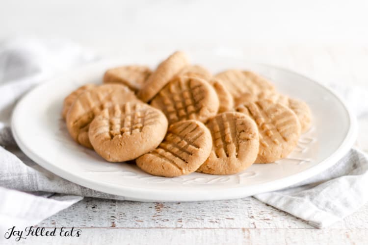 keto no bake peanut butter cookies in a small pile on a white plate