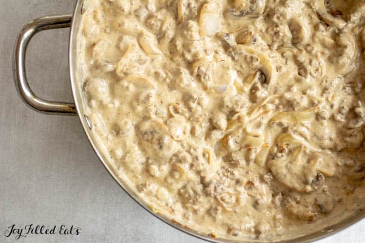 large skillet filled with ground beef stroganoff