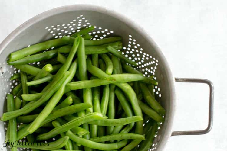 washed green beans in metal colander
