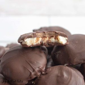 Close up of homemade peppermint patties with bite missing from top candy