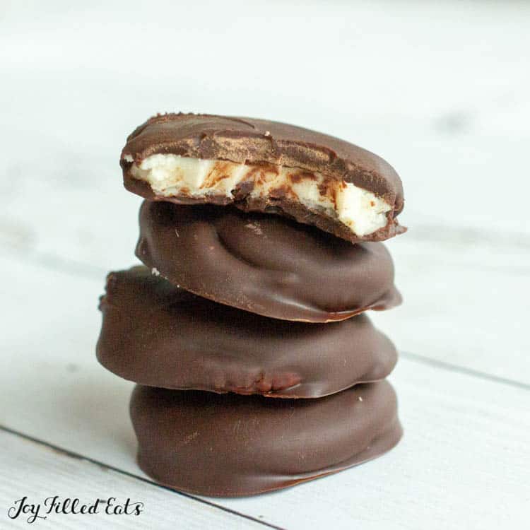 stack of homemade peppermint patties with top candy missing large bite