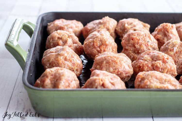 Oven pan filled with meatballs ready to be cooked
