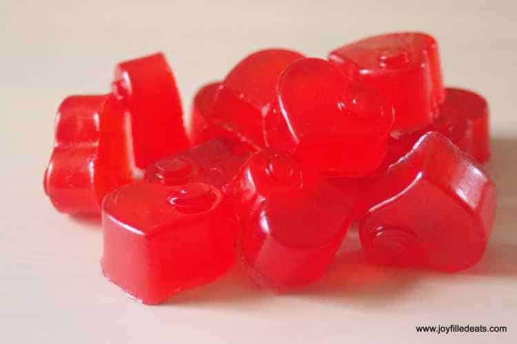 Close up on pile of red heart shaped gummies