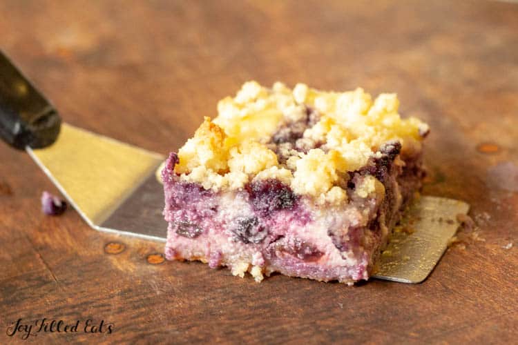 Serving Spatula with Square piece of Lemon Blueberry Cheesecake Crumb Bars