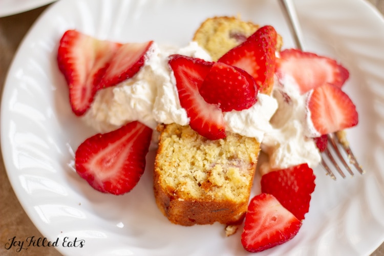 Keto pound cake strawberry shortcake on a white plate with a fork