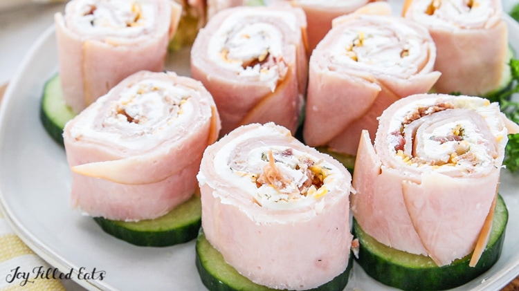 a plate of turkey pinwheels with bacon
