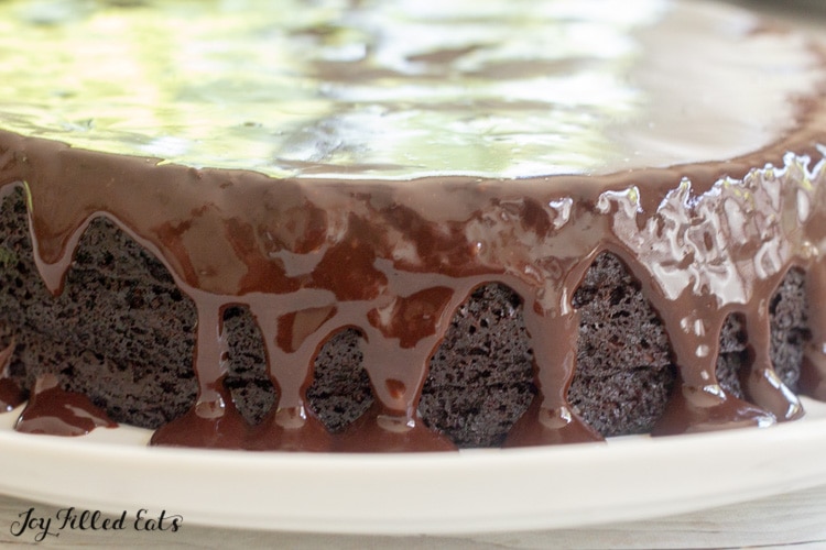 chocolate pan frosting dripping down the sides of a cake
