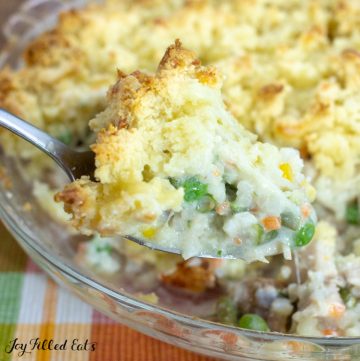 close up on keto chicken pot pie with biscuit topping with slice missing