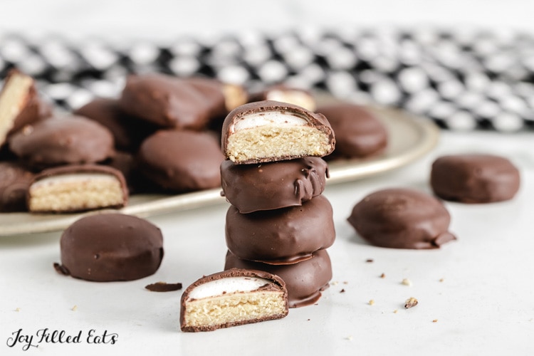 keto mallomars stacked on top of each other with one cut in half