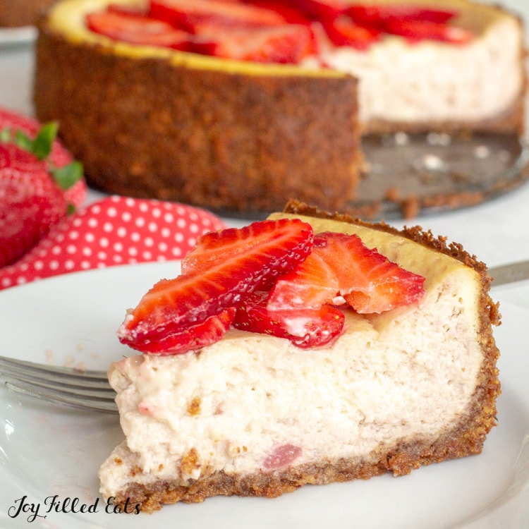 a slice of Keto Strawberry Cheesecake on a small plate
