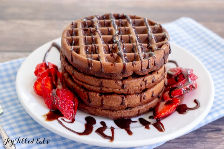 a stack of chocolate chaffles on a white plate