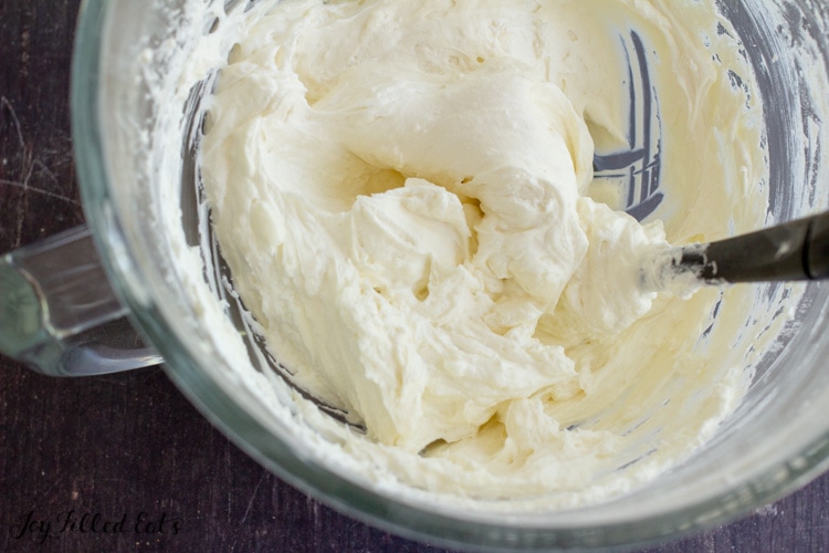 whipped cream being folded into the cream cheese