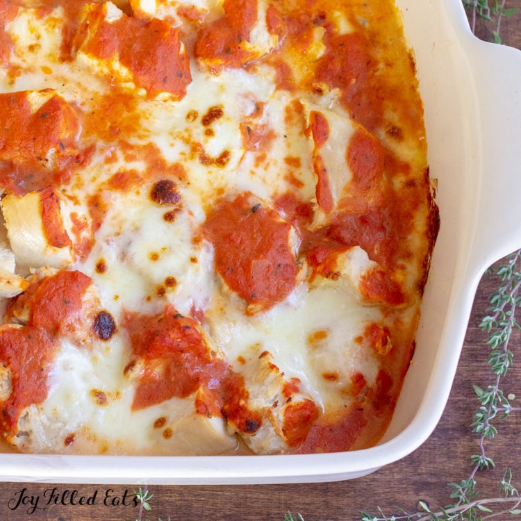 casserole dish with chicken, vodka sauce, and cheese