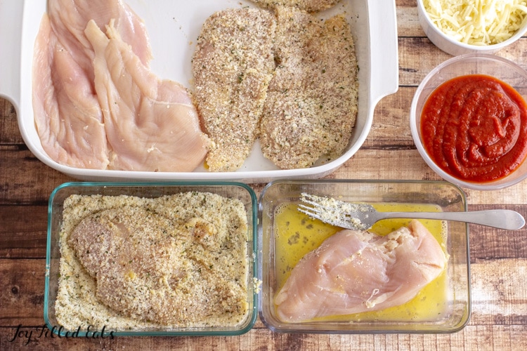 chicken in various stages of breading