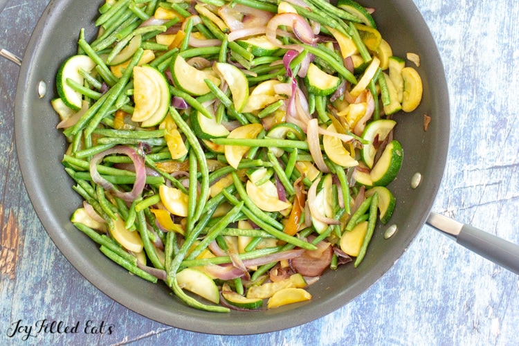 skillet with zucchini and green beans
