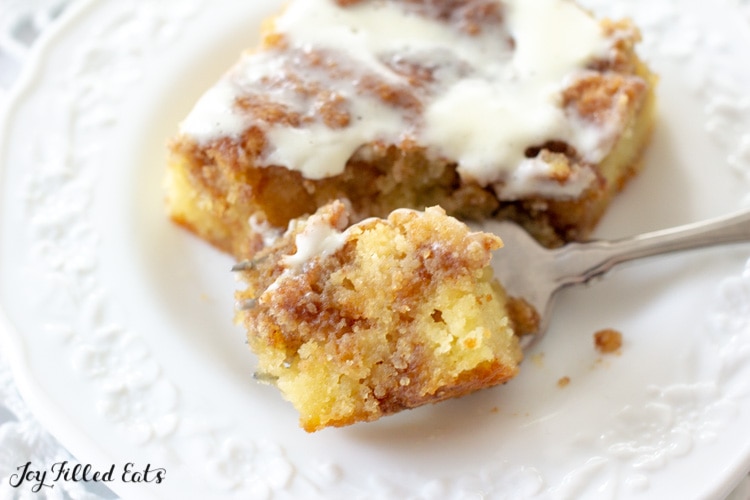 close up of a bite of cinnamon cake on a fork