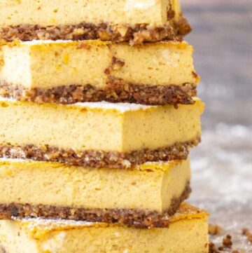 a stack of keto pumpkin cheesecake bars
