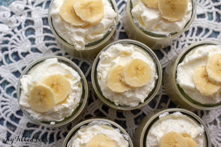 overhead shot of small jars with low carb banana pudding