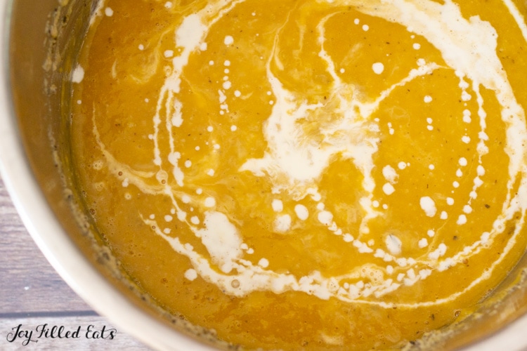 cream drizzled on top of the pureed soup