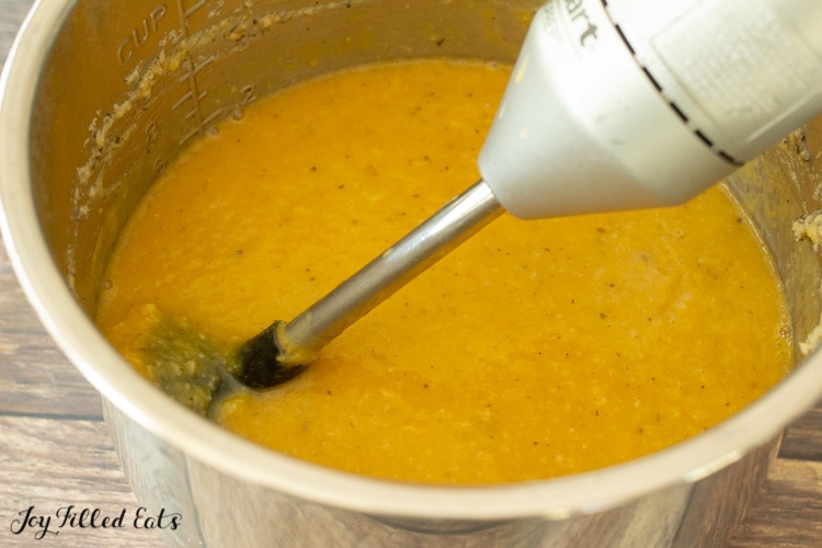 immersion blender in the pot of soup